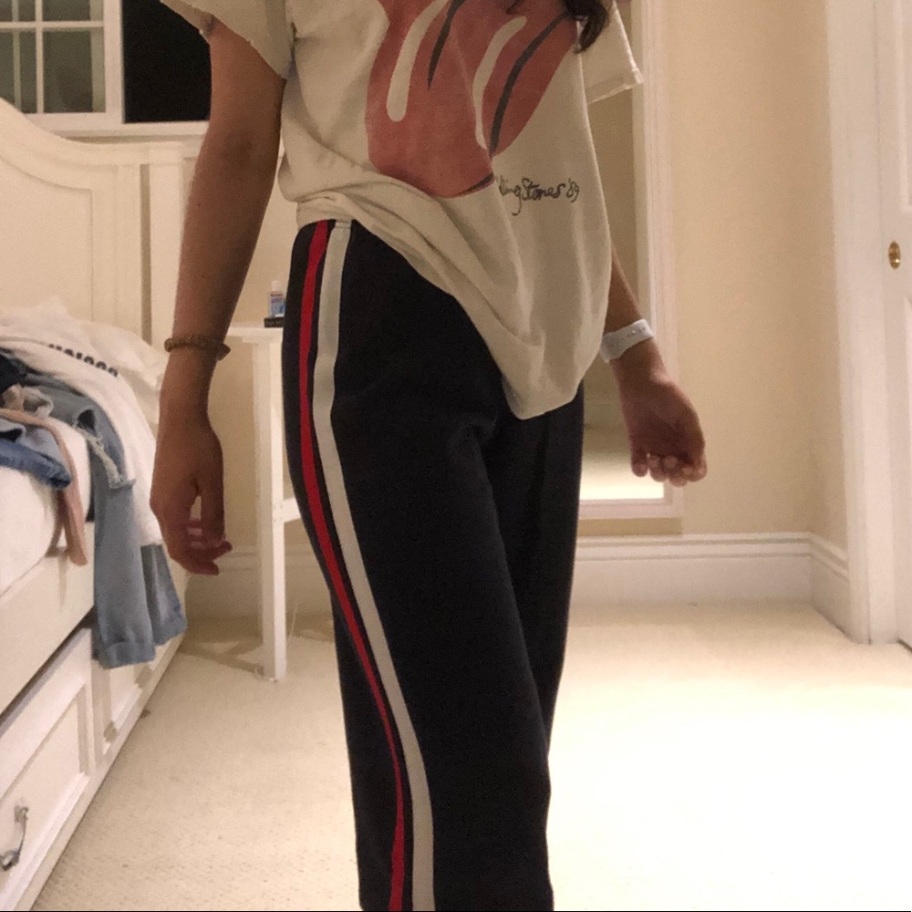 navy blue sweats w/ red & white stripes